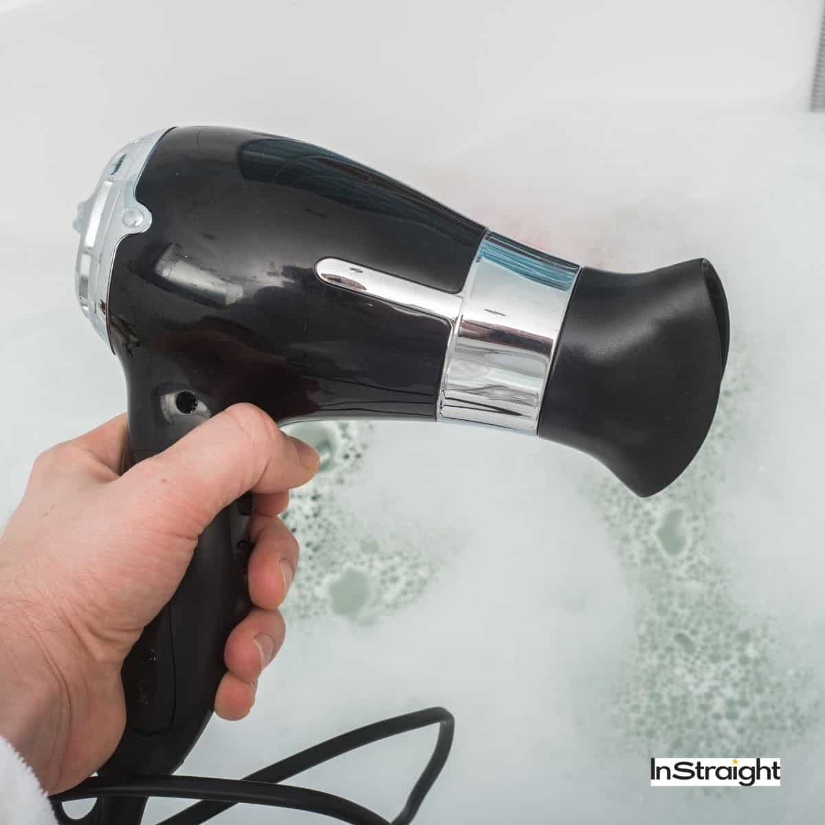 hand holding A Hair Dryer